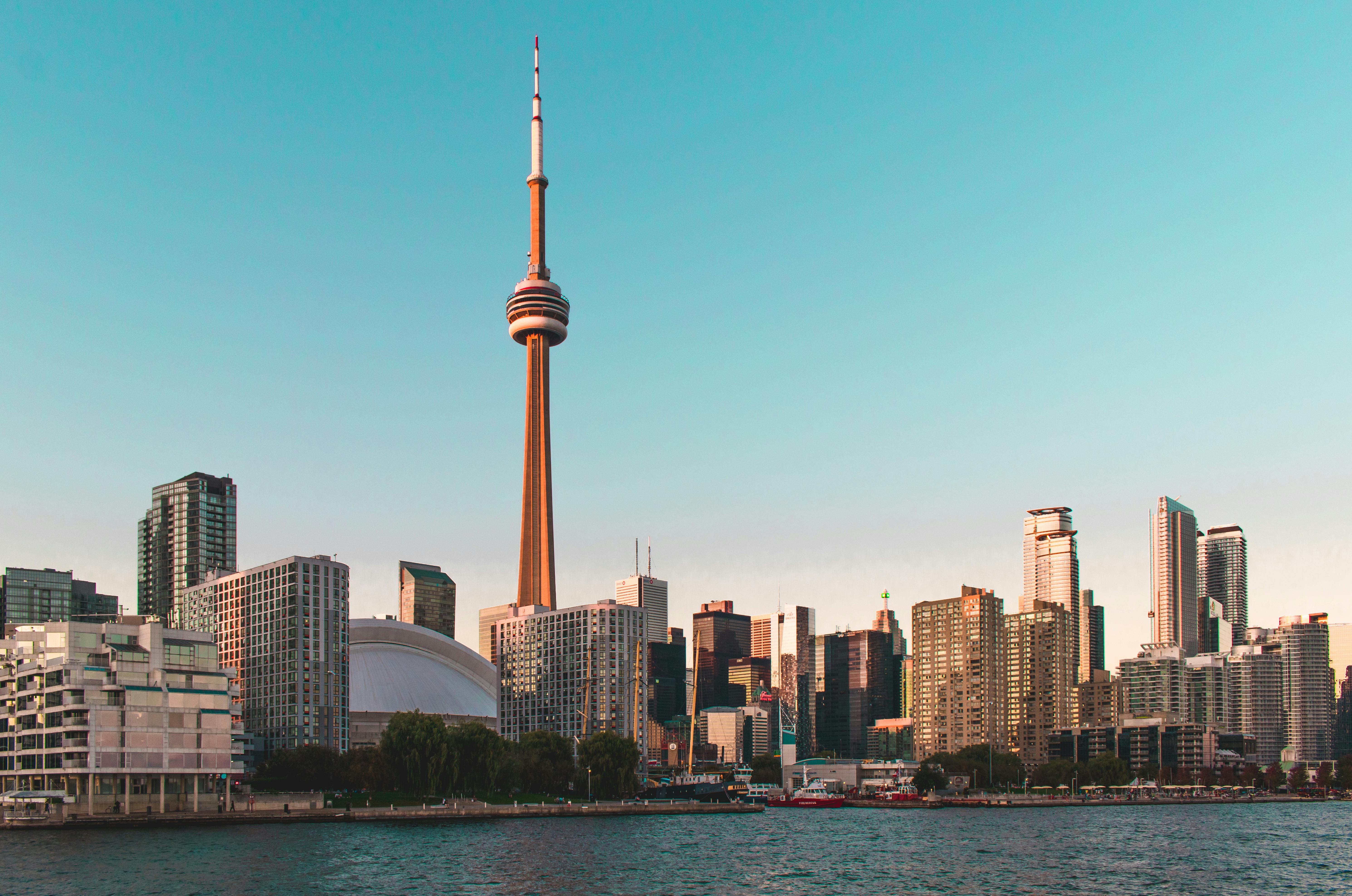 Beautiful view of Toronto's skyline featuring the iconic CN Tower during sunset.